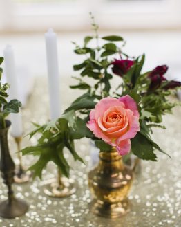 gold sequin table runner and vintage vases